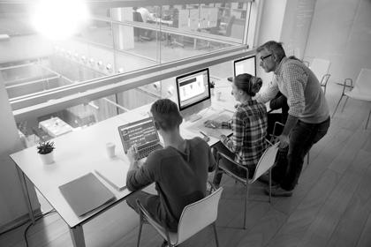 Upper view of students in class working on computers